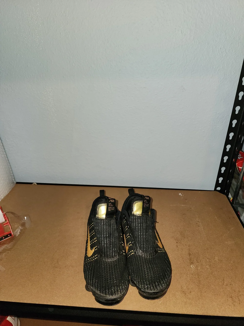Nike Kids Black and Gold Slip-On Athletic Sneakers